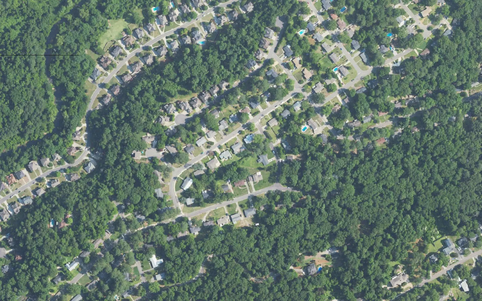 Aerial view of the wooded residential streets of Forest Brook and Huntington Park on Homewood's south edge.