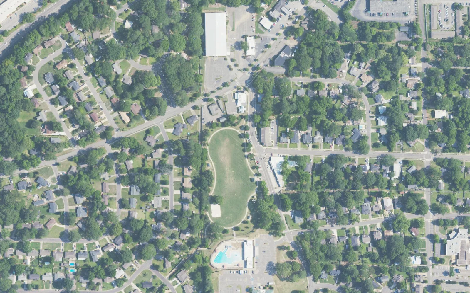 Aerial view of Patriot Park in West Homewood, with its pool, walking path and open field off Oak Grove Road.