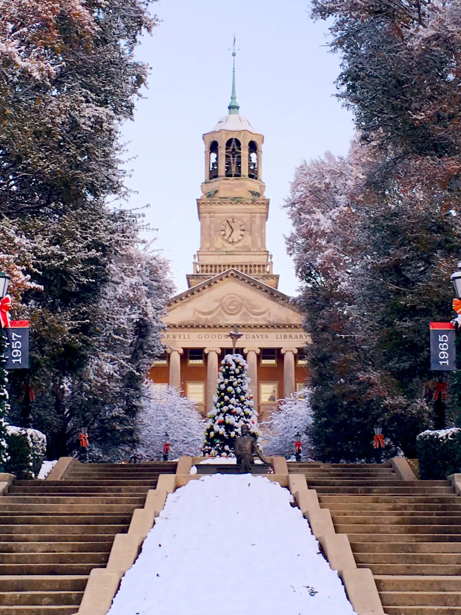 Snow on the lawn in front of a Samford University building at dawn, in Homewood.