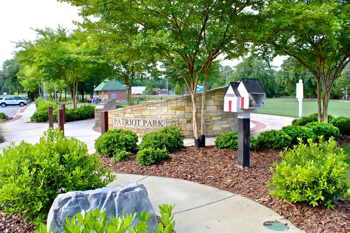 The entrance sign and landscaping at Patriot Park in West Homewood